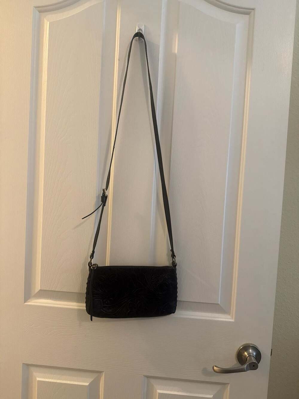 Hobo Cadence Black Tooled Leather Crossbody Bag